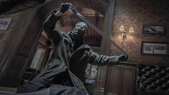 Paul Dano's Riddler prepares for the kill in a scene from The Batman.