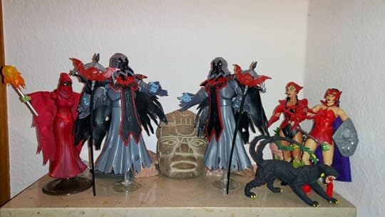 The Horde Wraiths prepare to open the tomb, while Shadow Weaver, Scorpia and Catra look on.