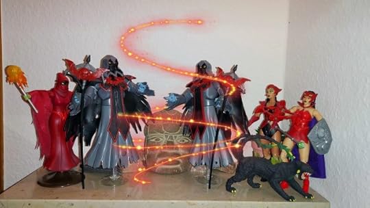 The Horde Wraiths are casting a spell to open the tomb, while Shadow Weaver, Catra and Scorpia look on.