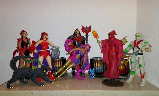 Hordak is on his throne with Entrapta draped at his feet, while Imp looks on. Shadow Weaver arrives with Catra and Scorpia to present Sibor a.k.a. Wrap Trap to Hordak.