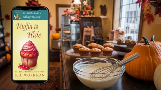 a bowl with a whisk in a bakery with muffins on a platter behind, autumn decorations