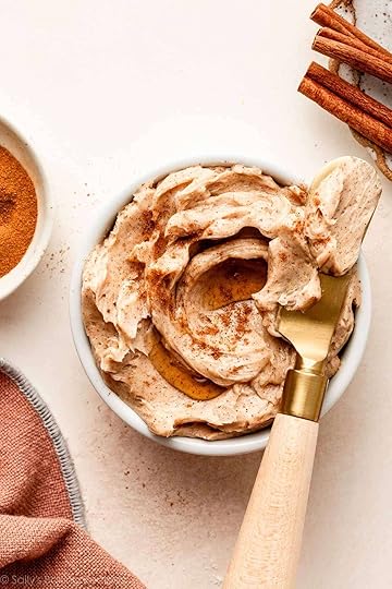 cinnamon butter in white dish with gold butter knife.