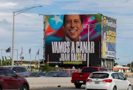 A billboard promoting Puerto Rico's Independence Party and the Citizen Victory Movement gubernatorial candidate Juan Dalmau towers over a highway