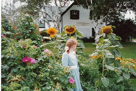 Red-haired girl in the garden at Green Gables
