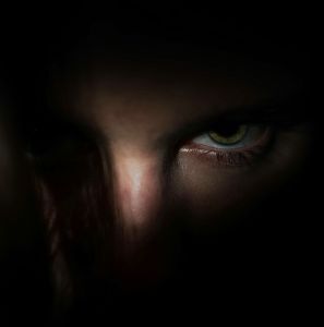 Dark photo of a glaring person