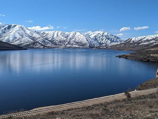 nice view of lake and mountains with snow