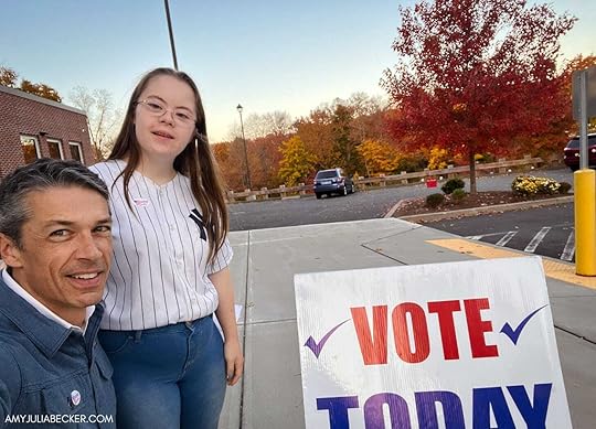 Peter and Penny take a selfie outside by a Vote Today sign