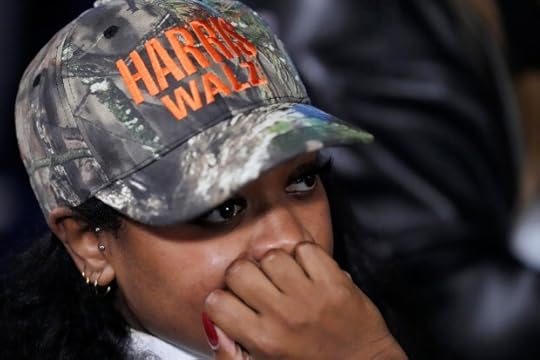 A supporter waiting during an election night campaign watch party for Democratic presidential nominee Vice President Kamala Harris
