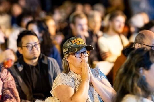 Jessica Reid reacts while watching election results update on a jumbo screen television in San Francisco