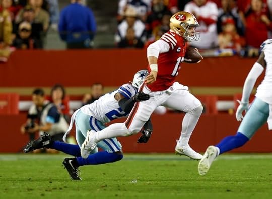 San Francisco 49ers starting quarterback Brock Purdy (13) scrambles for a first down against Dallas Cowboys' Amani Oruwariye (27) in the second quarter at Levi's Stadium in Santa Clara, Calif., on Sunday, Oct. 27, 2024. (Nhat V. Meyer/Bay Area News Group)