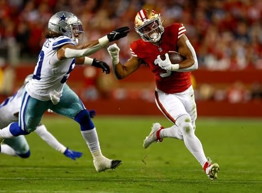 San Francisco 49ers' Isaac Guerendo (31) runs against Dallas Cowboys' Eric Kendricks (50) in the second quarter at Levi's Stadium in Santa Clara, Calif., on Sunday, Oct. 27, 2024. (Nhat V. Meyer/Bay Area News Group)