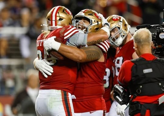 San Francisco 49ers' George Kittle (85) is congratulated on his touchdown by San Francisco 49ers' Dominick Puni (77) against the Dallas Cowboys in the third quarter at Levi's Stadium in Santa Clara, Calif., on Sunday, Oct. 27, 2024. (Nhat V. Meyer/Bay Area News Group)