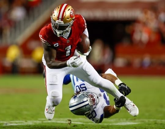 San Francisco 49ers' Deebo Samuel Sr. (1) is tripped up by Dallas Cowboys' Eric Kendricks (50) in the third quarter at Levi's Stadium in Santa Clara, Calif., on Sunday, Oct. 27, 2024. (Nhat V. Meyer/Bay Area News Group)