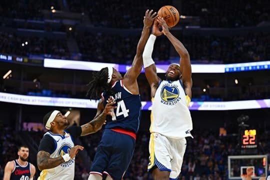 Golden State Warriors' Buddy Hield (7) battles Los Angeles Clippers' Terance Mann (14) for the ball in the third quarter of their NBA game at Chase Center in San Francisco, Calif., on Sunday, Oct. 27, 2024. (Jose Carlos Fajardo/Bay Area News Group)