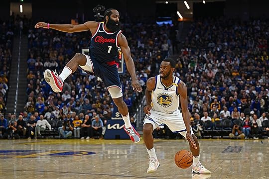 Golden State Warriors’ Andrew Wiggins (22) slips past Los Angeles...