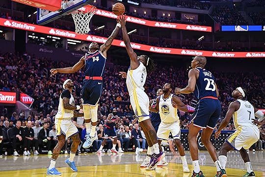 Los Angeles Clippers’ Terance Mann (14) battles Golden State Warriors’...