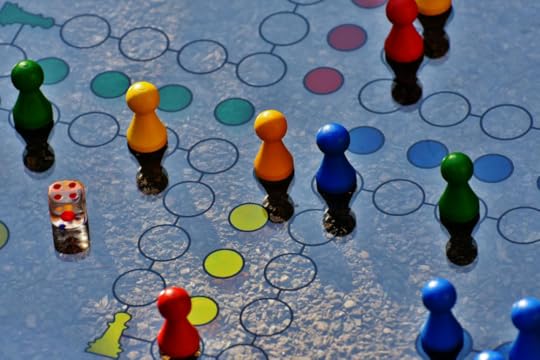 Image: A board game on which the gameplay has pieces moving from one circle to another in continuous fashion.