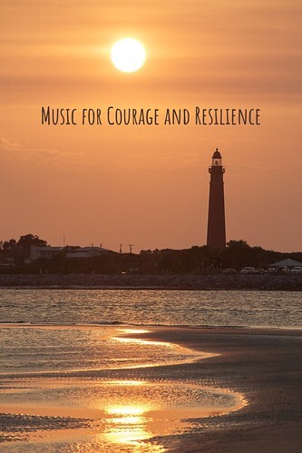 Lighthouse nearing sunset, with orange sky and reflective waves. From Music for Courage and Resilience