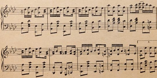 Two staffs of musical notation, showing many chord changes and fast progressions.