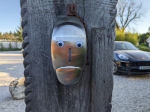 Hang gel dispenser with eyes stuck on it so it looks like a face.