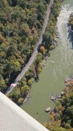 A jumper parachutes after jumping off the New River Gorge Bridge