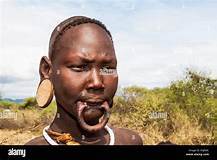 Africa, Ethiopia, Southern Omo Valley, Mursi Tribe. Mursi woman without ...