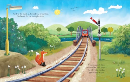Image of fox sitting beside a railway track as a red train approaches from a bridge that crosses the river. Sun and hills in the background.