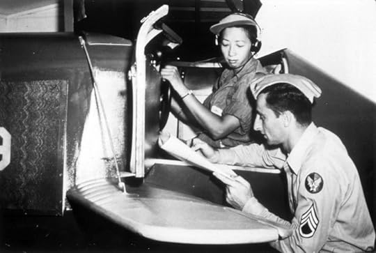 WASP Hazel Ying Lee reviews her performance after a session in a Link trainer, 1944 (US Air Force photo)