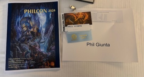 Philcon 2024 Program Book, Badge, and Tent Card