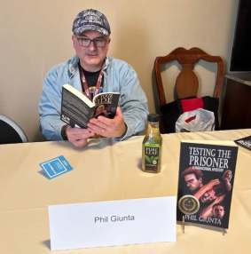 Phil reading from his novel, By Your Side