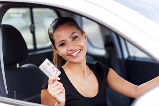 woman holding driver license