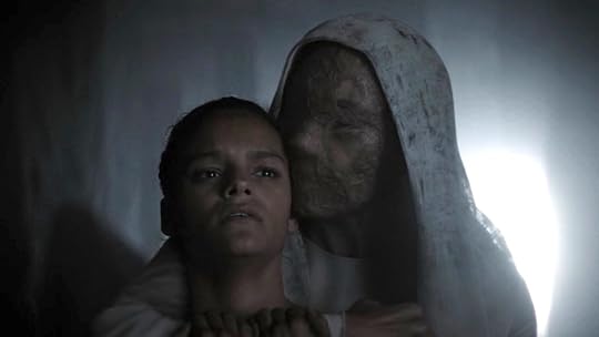 A memory ghost in a hood holds Lila during the Agony on Dune: Prophecy