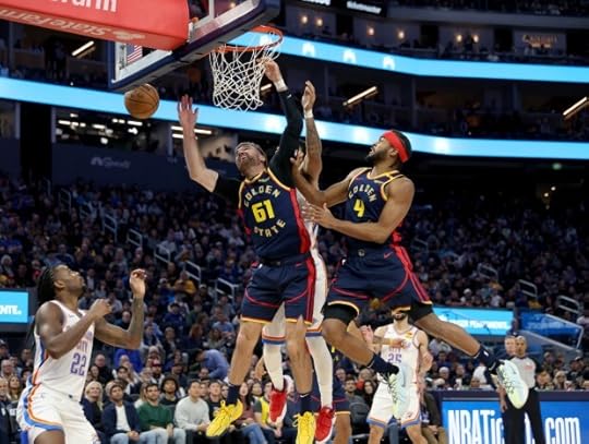 Golden State Warriors' Pat Spencer #61 and Moses Moody #4 vie for a rebound in the third quarter of their NBA game against the Oklahoma City Thunder at the Chase Center in San Francisco, Calif., on Wednesday, Nov. 27, 2024. (Jane Tyska/Bay Area News Group)