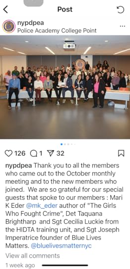 Group photo of approximately 26 people in a lecture hall at Police Academy College Point. The individuals are arranged in rows, both standing and sitting, on tiered seating. The NYPD seal is visible on the wall behind them. The caption expresses gratitude to members who attended a monthly meeting and acknowledges guest speakers.