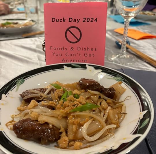 A pink menu and a single bowl of food. 