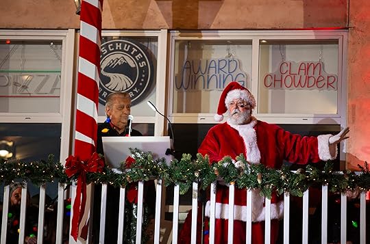 Santa Claus addresses the crowd beside Ted Balestreri during the...