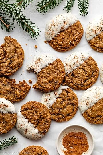 white chocolate dipped gingerbread latte cookies with cinnamon sprinkled on top.
