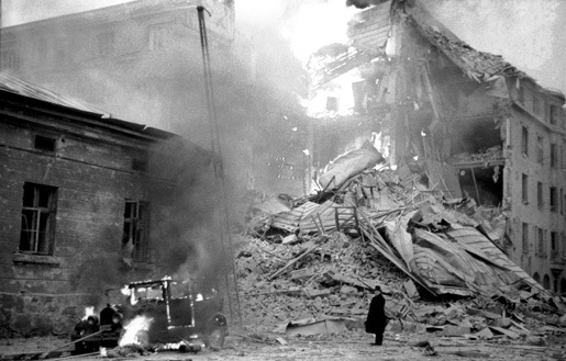 Burning building in Helsinki, Finland after Soviet bombing, 30 November 1939 (public domain via Wikipedia)