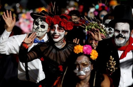 People take part in the Catrinas Parade, representing the character of La Catrina to commemorate the Day of the Dead, in Guadalajara, Mexico. (Photo by Ulises Ruiz, AFP via Getty Images)