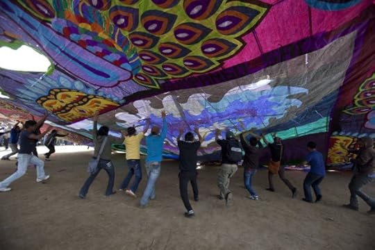 A group of men raise a 'barrilete', a giant kite, during the All Saints day celebration in Sumpango, Guatemala in 2012. (Saul Martinez/EFE/ZUMAPRESS.com)