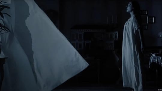 The shadow of Count Orlok haunts Ellen (Lily-Rose Depp) in Nosferatu.