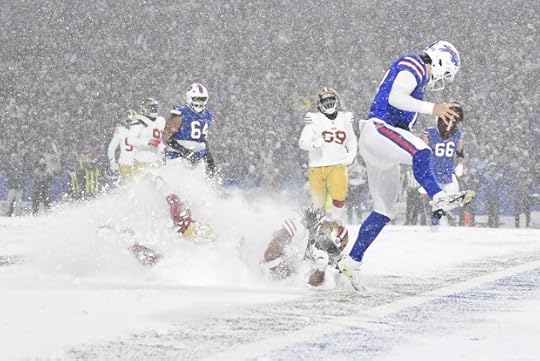 Buffalo Bills quarterback Josh Allen, right, scores past San Francisco 49ers linebacker Fred Warner, bottom, during the second half of an NFL football game in Orchard Park, N.Y., Sunday, Dec. 1, 2024. (AP Photo/Adrian Kraus)