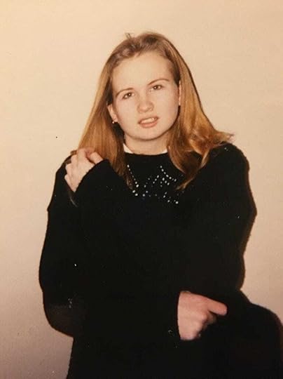 A picture of teenage me at school with a black woolly jumper over my uniform and terrible eyebrows