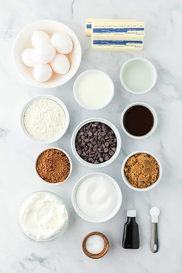 Overheat shot of ingredients for making chocolate pound cake in a marble surface before baking
