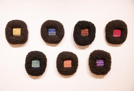 Installation photo of For Colored Girls, A Rainbow (2020), by Sonya Clark, the 2014 Prize winner. Wigs, cast plastic combs, and wrapped thread. On loan from the artist and Goya Contemporary, Baltimore. Installation photo by MCG Photography, from the exhibition opening.