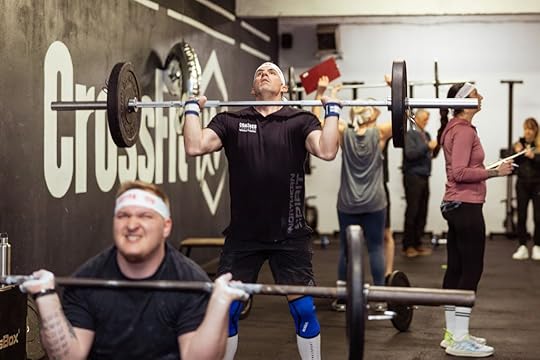A photo of Ivan Racic doing a thruster at CrossFit XV in Croatia.