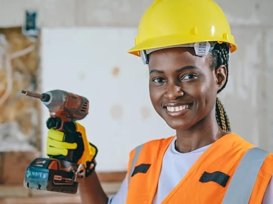 woman with skilled trade holding drill