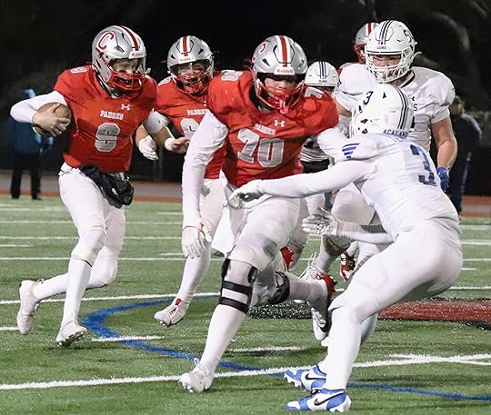 Carmel quarterback Hudson Rutherford finds running room up the middle...