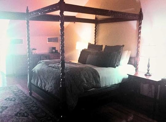 In New Orleans in our atmospheric, spooky-looking room, with its dark oak furniture and four-poster bed 