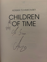 Title page for Children of Time by Adrian Tchaikovsky, signed "To Simon" by the author, with a drawing of a spider